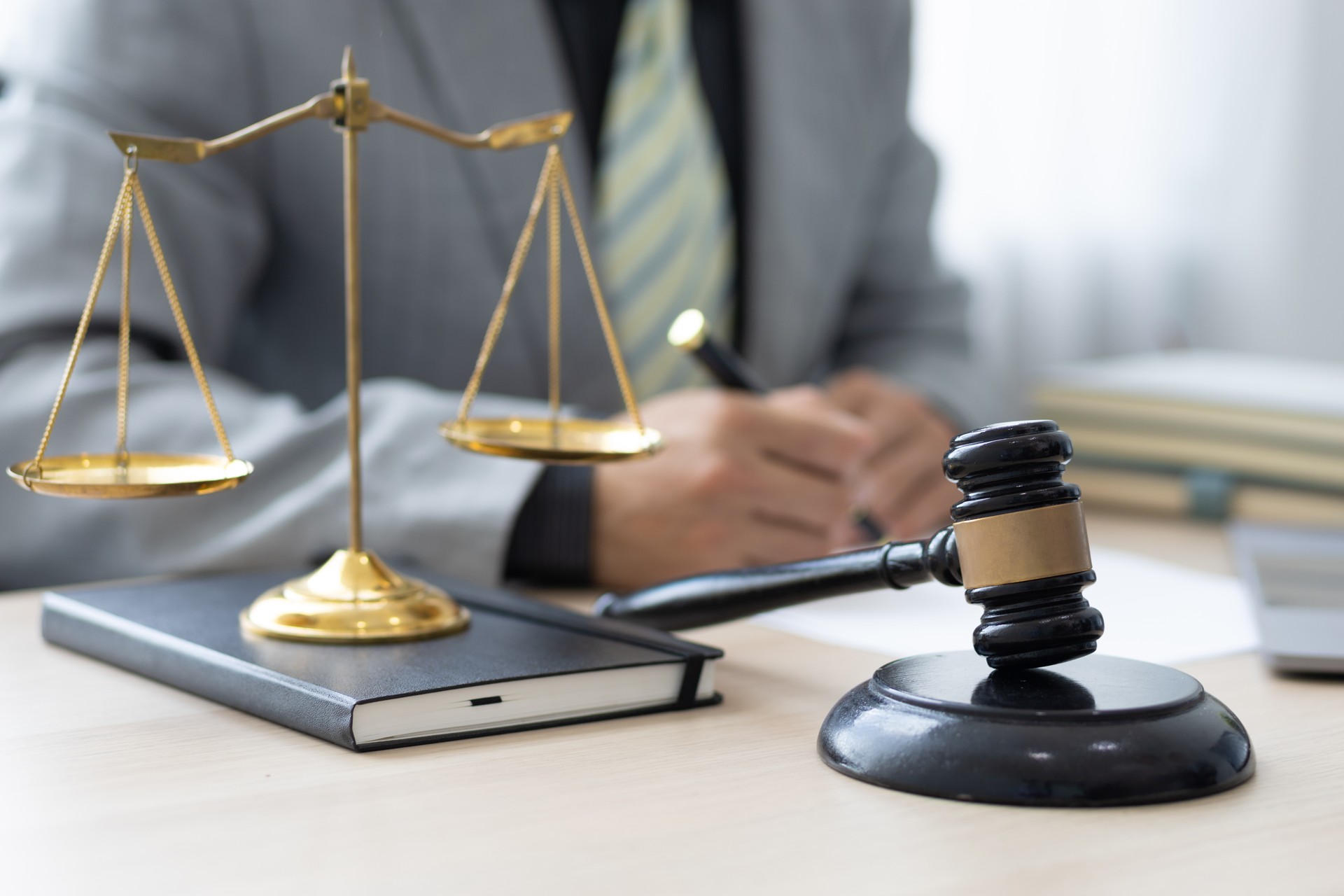 Attorney working on a desk in a law firm.